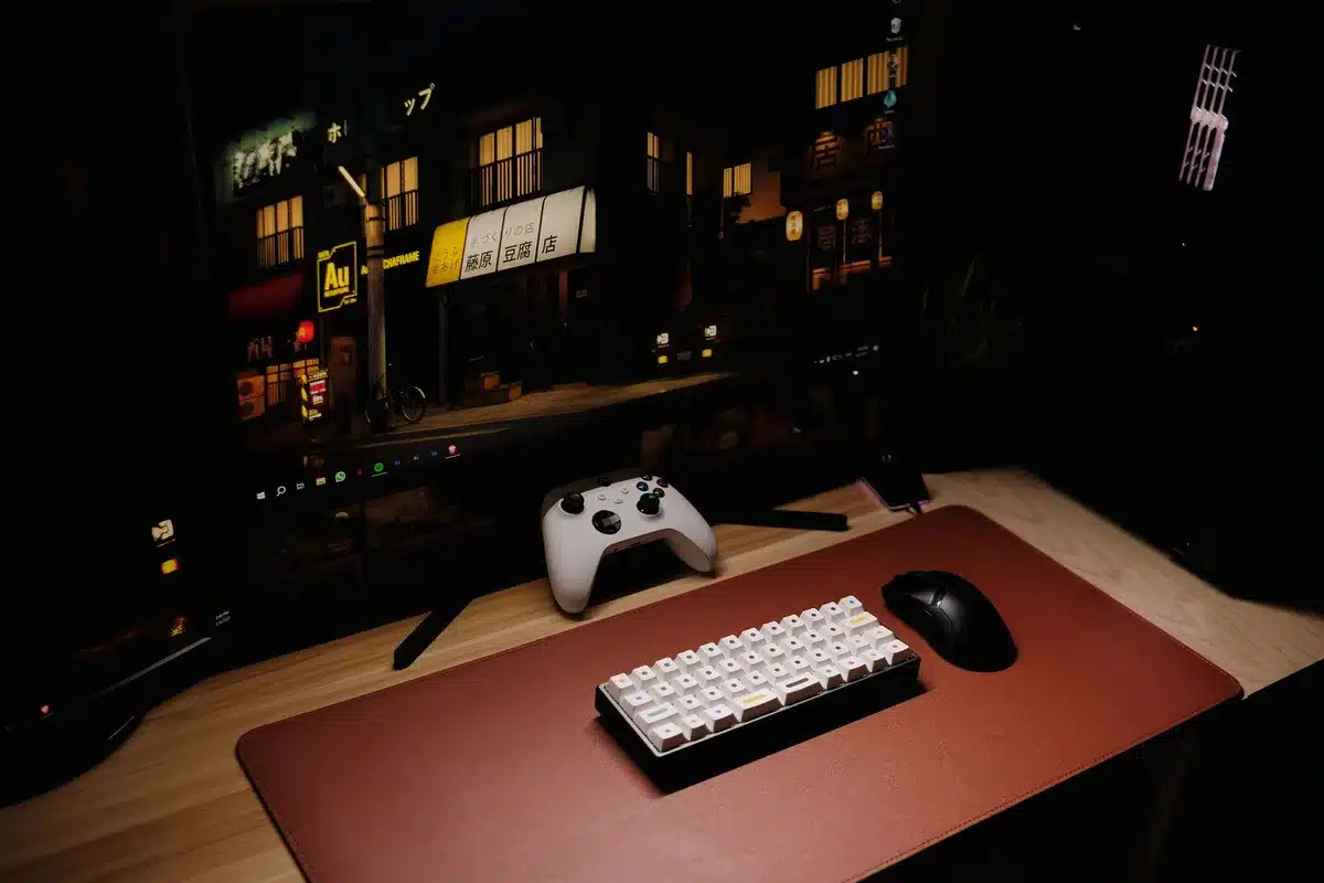 compact mini PC on a small desk with two external monitors, no logos, empty workspace